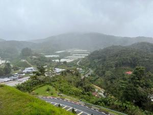 a view of a road on a mountain with a street at MAGICAL HOMESTAY CAMERON HIGHLANDS in Cameron Highlands