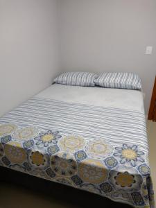 Postel nebo postele na pokoji v ubytování Grey House, próximo a Gramado e ao Templo Budista
