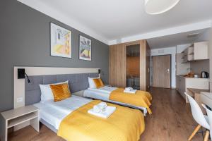 Posteľ alebo postele v izbe v ubytovaní Aparthotel City Break Wolska