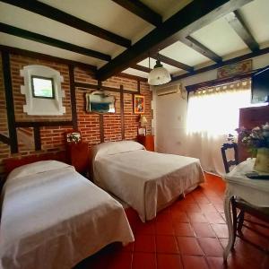 A bed or beds in a room at Los Azahares de Tigre