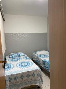 Ein Bett oder Betten in einem Zimmer der Unterkunft Plaza Norte Residence