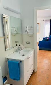 En eller flere senge i et værelse på Rosa Golf