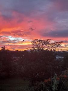 a sunset with a colorful sky in the background at Casa Costa Rica Boutique B&B in Pilas