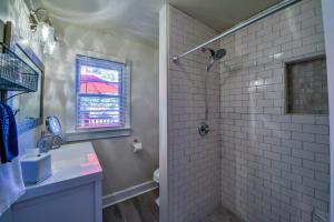 a bathroom with a shower and a sink at Sherwood House in Tuscaloosa +35 photos