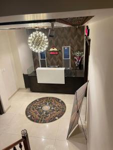 a bathroom with a sink and a mirror at Jhelum Inn Hotel in Jhelum