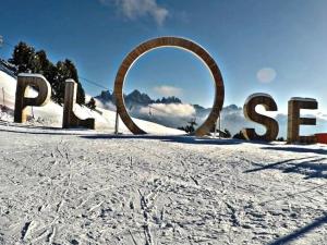 a sign for the park in the snow at Weinberg Apartments & Acquarenacard in Naz-Sciaves