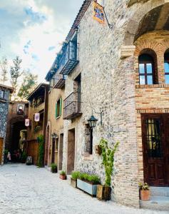 a stone building with a flag on the side of it at Atrani in Santeagueda