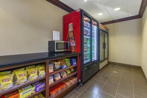 a grocery store aisle with a refrigerator and food at Holiday Inn Express & Suites Milwaukee NW - Park Place, an IHG Hotel in Milwaukee