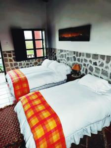 Postel nebo postele na pokoji v ubytování Hacienda Hato Verde