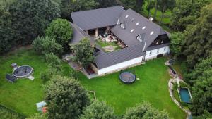 an overhead view of a large house with a yard at Penzion U dvojice in Nové Město na Moravě