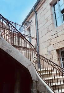 a staircase leading up to a brick building at Les Tiercelines in Dole