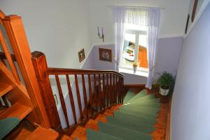 a staircase with a large green leaf on the floor at Vila Ana Generoes Bled in Bled