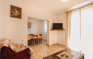 a living room with a couch and a table at Apartment Frankovici Stara Vala - Tinjan Istra in Tinjan