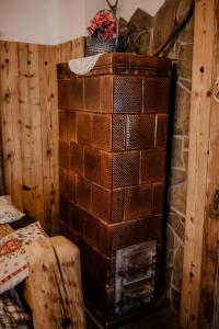 a stack of bricks sitting on top of a fireplace at Chatka Zapiecek in Krościenko