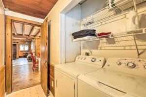 a laundry room with a washer and dryer at Black Bear Lodge A Rural White Mtns Retreat in Chatham +22 photos
