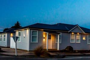 a row of modular homes at night at Rata Boutique Apartments in Ohakune