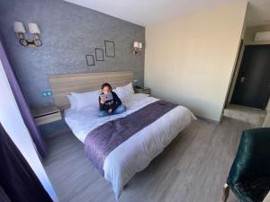 Postel nebo postele na pokoji v ubytování Hôtel Saja