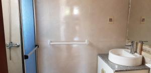 a small bathroom with a sink and a shower at La Quimera del Águila in Atlántida +35 photos