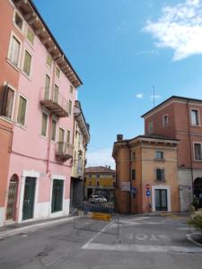 an empty street in a city with buildings at B&B A Casa di Sara in Pescantina