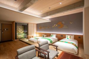 Postel nebo postele na pokoji v ubytování Hotel Legasta Kyoto Higashiyama Sanjo