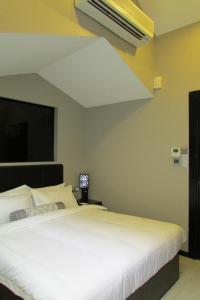 The Southbridge Hotel tesisinde bir odada yatak veya yataklar
