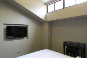 The Southbridge Hotel tesisinde bir odada yatak veya yataklar