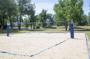 a volley ball net on a sandy field at Stay Berkshires in Williamstown