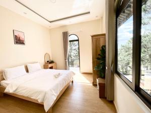 Giường trong phòng chung tại Gia An - hotel in Dalat