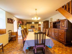 a kitchen and dining room with a table and chairs at Gîte Montignac, 5 pièces, 8 personnes - FR-1-616-218 in Montignac