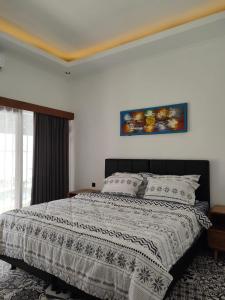 Postel nebo postele na pokoji v ubytování Villa HOMEY Lombok