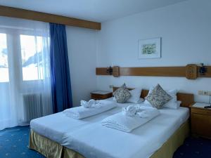 Postel nebo postele na pokoji v ubytování Hotel Marienhof