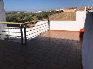 a balcony with a fence and a view of a field at La Casa del Muti in Campanario