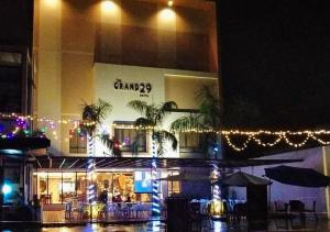een gebouw met kerstverlichting ervoor bij RedDoorz Premium @ GRAND 29 Hotel in Dumarao