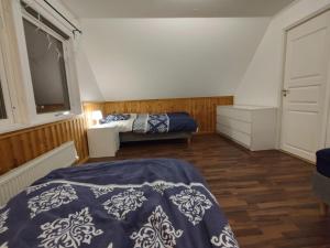 Llit o llits en una habitació de Villa Stolle