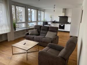 A seating area at Zimmer & Appartements am Schloßplatz