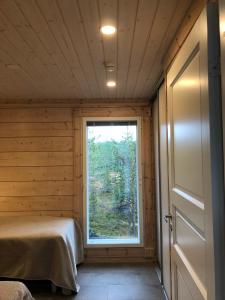 Postel nebo postele na pokoji v ubytování Rokovan Helmi - Natural peace in Ruka-Kuusamo