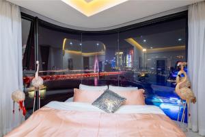 a bedroom with a bed with a view of a city at Baihong.Riverview Apartment in Chongqing