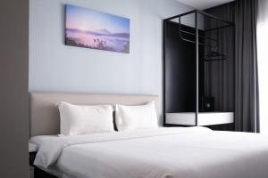 Llit o llits en una habitació de Inkk Hotel @ Aeropod by Pinstay