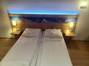 Ein Bett oder Betten in einem Zimmer der Unterkunft Gästehaus Gritscher