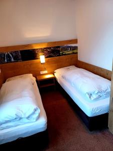 Ein Bett oder Betten in einem Zimmer der Unterkunft Gästehaus Gritscher