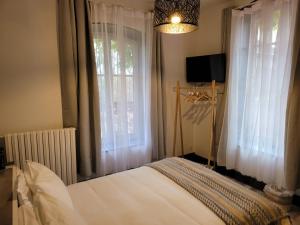 Postel nebo postele na pokoji v ubytování Le Chalet Montégut