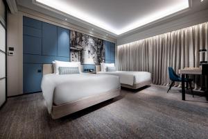 Voodi või voodid majutusasutuse Lisboeta Macau toas