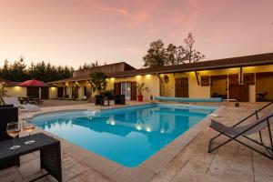 a swimming pool in the backyard of a house at Domaine Sur-Valot in Beaubery