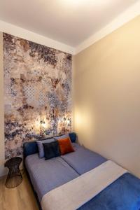 Posteľ alebo postele v izbe v ubytovaní E12 Boutique Apartments