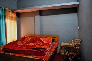 Cama ou camas em um quarto em Tripa Homestay