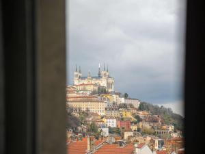 a large building with a view of a city at Mercure Lyon Centre Château Perrache in Lyon