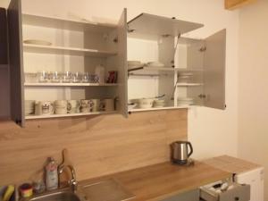 Kuchyňa alebo kuchynka v ubytovaní Turistický apartmánový domček Runina 11