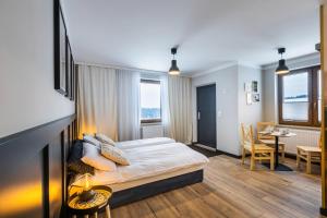 Ein Bett oder Betten in einem Zimmer der Unterkunft Przystanek Babia Apartamenty