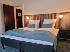 Hotel Phønix Hjørring 객실 침대