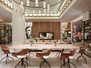 a large dining room with a large table and chairs at Palacio de los Duques Gran Meliá - The Leading Hotels of the World in Madrid